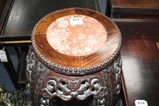 A Chinese carved hongmu vase stand, with rouge marble inset top, Diam. of top 28cm, overall W.34cm H.91cm